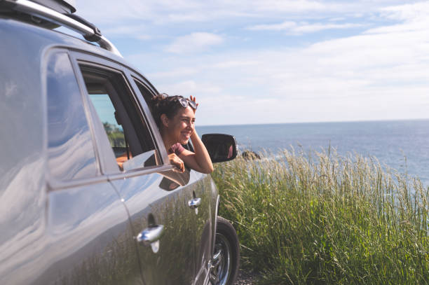 istock Group of friends inside car at viewpoint off Oregon Coast 843969892