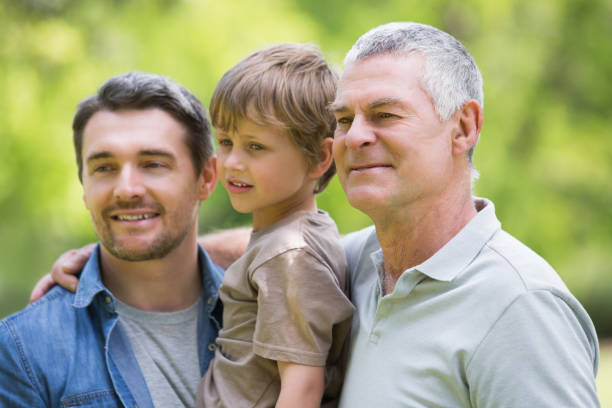istock Grandfather father and son smiling at park 843969986