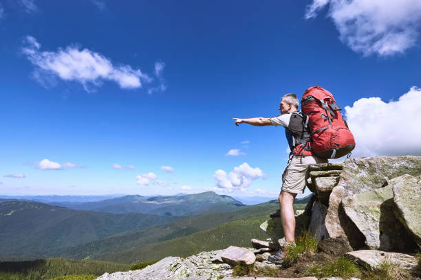 istock Hiking in the mountains in the summer with a backpack. 843972970