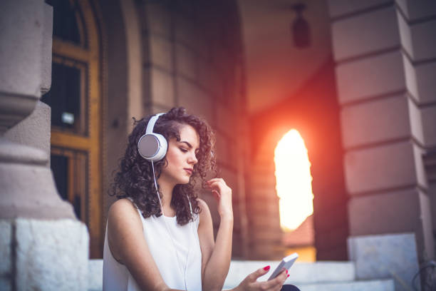 istock Curly hair female with touchpad 843973600