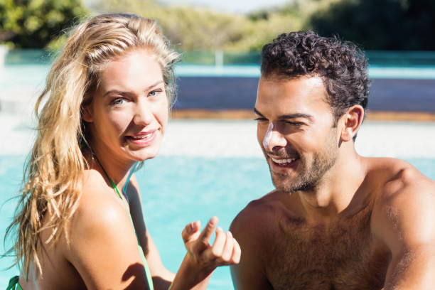 istock Girlfriend applying cream to boyfriend 843973624