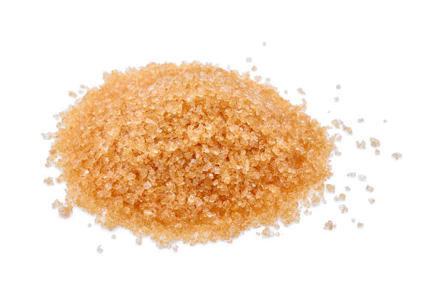 istock pile of brown cane sugar isolated on white background 843977632
