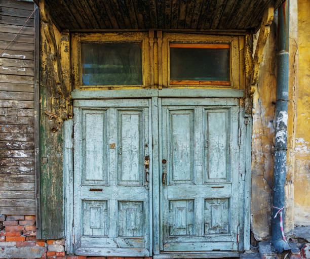 door covered with blue shabby paint  in an old house
