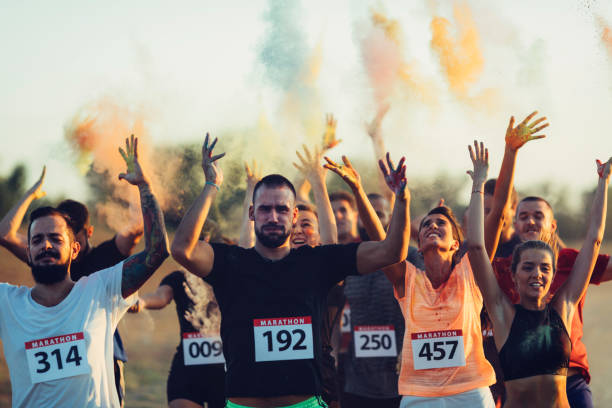 istock Marathon Runners Throwing Holi Colors 843978606