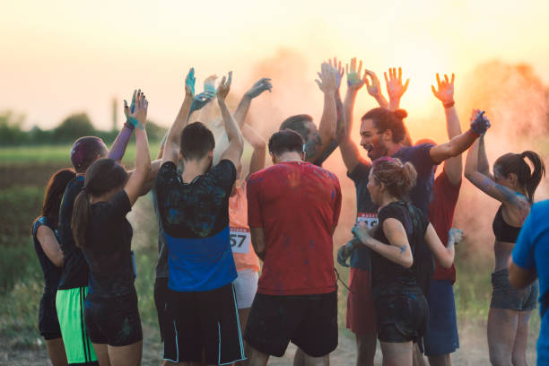 istock Marathon Runners Throwing Holi Colors 843978894