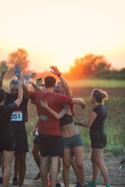 istock Marathon Runners Throwing Holi Colors 843978902