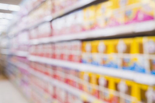 blur supermarket shelves with baby formula milk product on the shelf