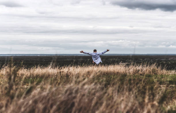 istock Man who feels free, looking at the horizon 843985606