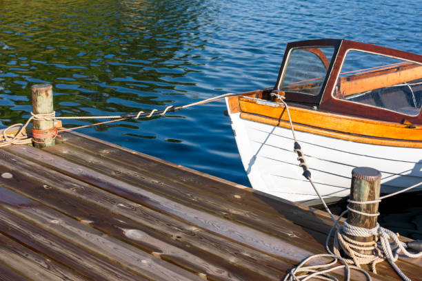 istock Vintage motorboat front tied to pier 843989154