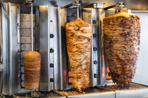 istock Greek gyros shop, stacked meat roasting 843990042