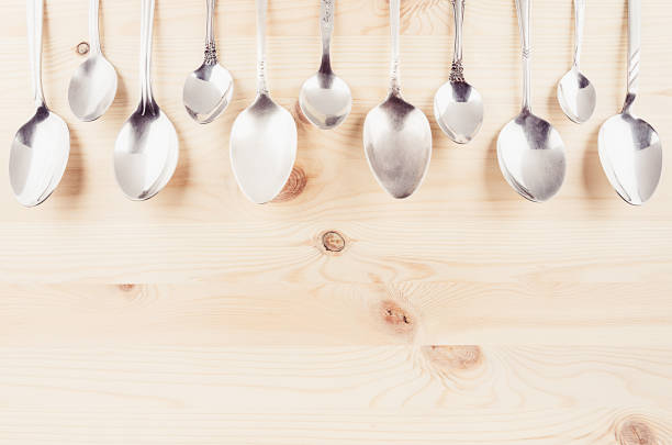 istock Collection rustic empty spoons on beige wood background. Mockup for designer, restaurant menu, advertising. 843990164