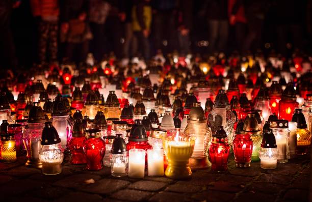 istock Burning candles at a cemetery during All Saints Day 843990776