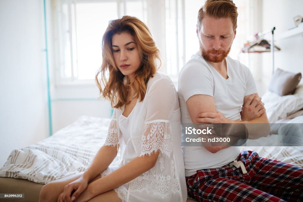 Unhappy married couple on verge of divorce due to impotence Unhappy married couple on verge of divorce due to impotence and jealousy Adult Stock Photo