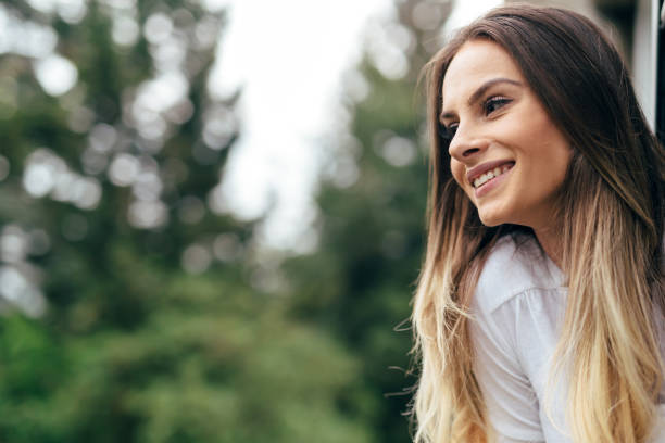 istock Beautiful brunette smiling outdoors in nature 844000816