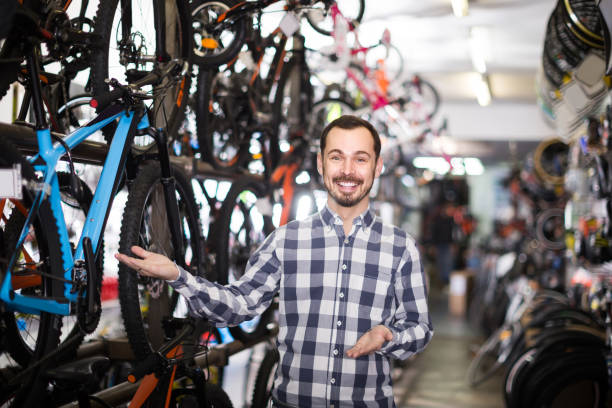 istock man points his hand and looks at various bicycle parts 844000920