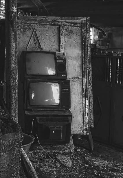 istock Vintage old television TV sets broken and ruined inside abandoned house 844003476
