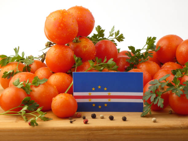 istock Cape Verde flag on a wooden panel with tomatoes isolated on a white background 844004422