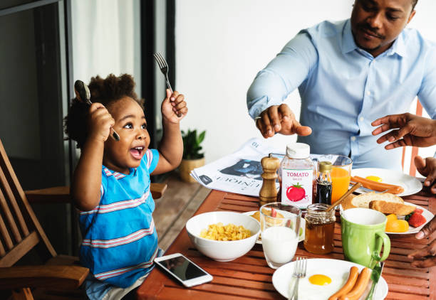 istock Black family having breakfast together 844007522
