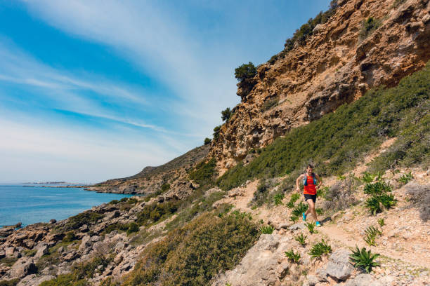 istock Man running in inspirational mountains and seaside 844008022