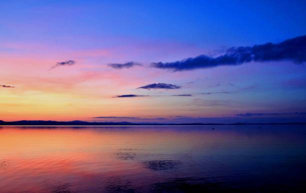 istock orange and blue sunset on the lake 844008202