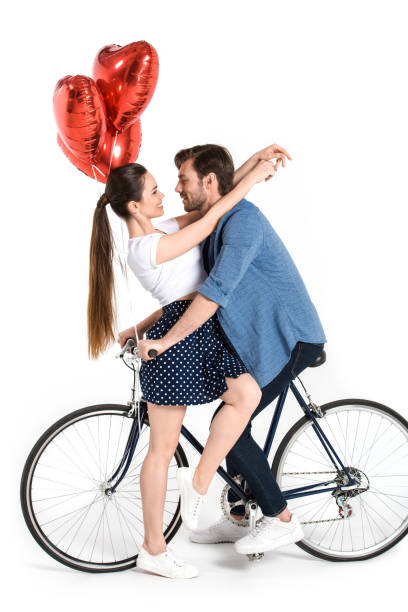 istock couple with bicycle and balloons 844012020