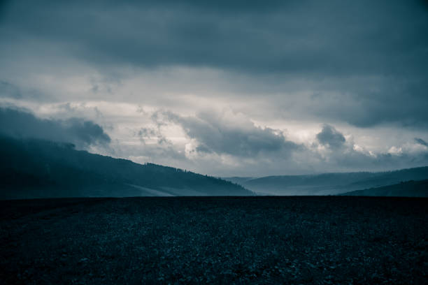A beautiful, abstract monochrome mountain landscape in blue tonality. Decorative, artistic look in black and white style.