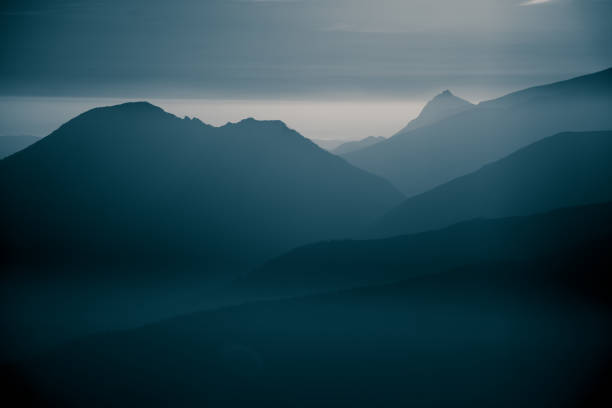 istock A beautiful, abstract monochrome mountain landscape in blue tonality. Decorative, artistic look in black and white style. 844012846