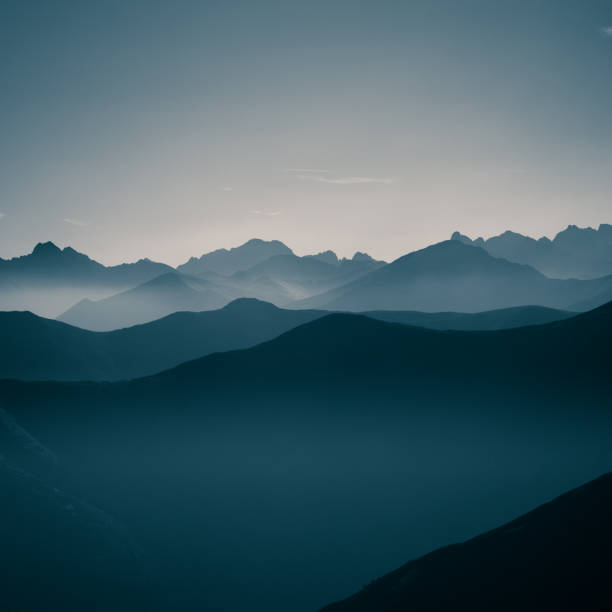 istock A beautiful, abstract monochrome mountain landscape in blue tonality. Decorative, artistic look in black and white style. 844012848