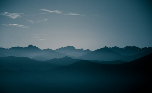 istock A beautiful, abstract monochrome mountain landscape in blue tonality. Decorative, artistic look in black and white style. 844012908