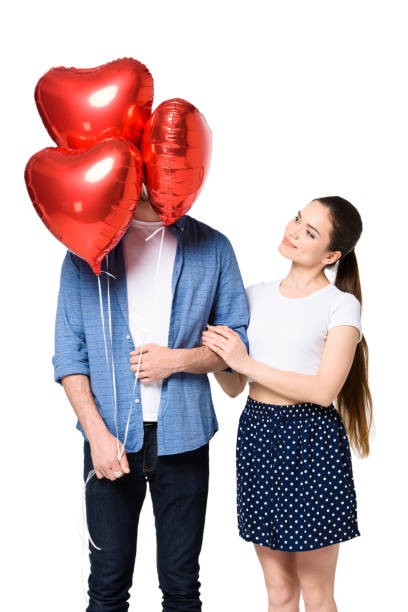 istock couple with heart shaped balloons 844016212