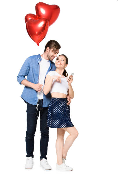 istock couple with smartphone and balloons 844016380
