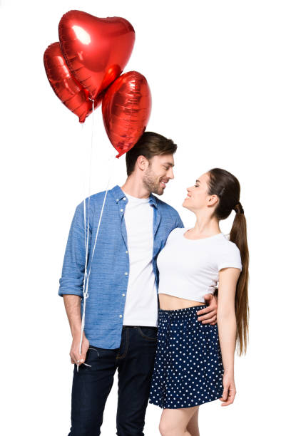 istock couple with heart shaped balloons 844017032
