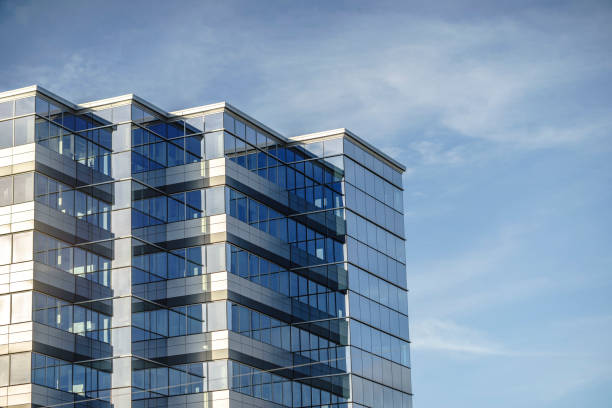 istock Modern business office made from glass against blue sky 844027458
