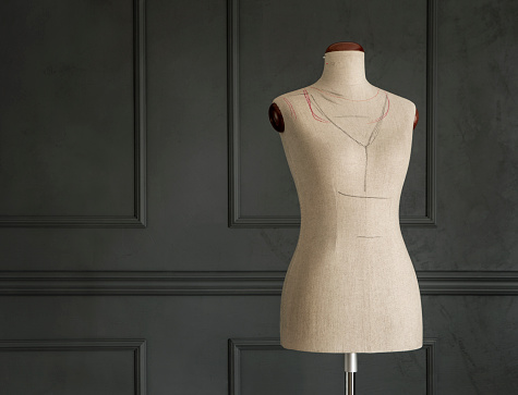 Vintage tailor's mannequin in elegant room with copy space