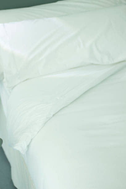 istock Luxury five star hotel bedroom bed sheets and linen clean 844027856