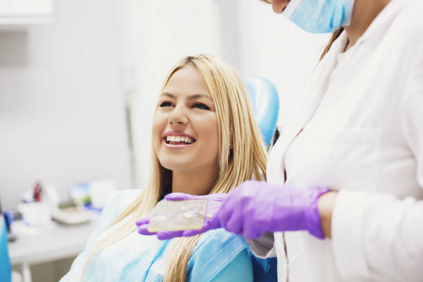 istock Blonde woman in dentist office 844028232