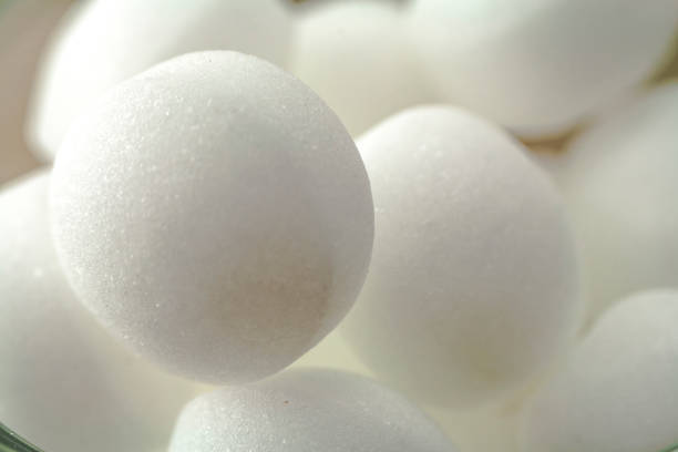 istock Pile of moth balls in close up view 844031304
