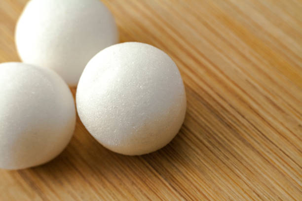istock Pile of moth balls in close up view 844031684