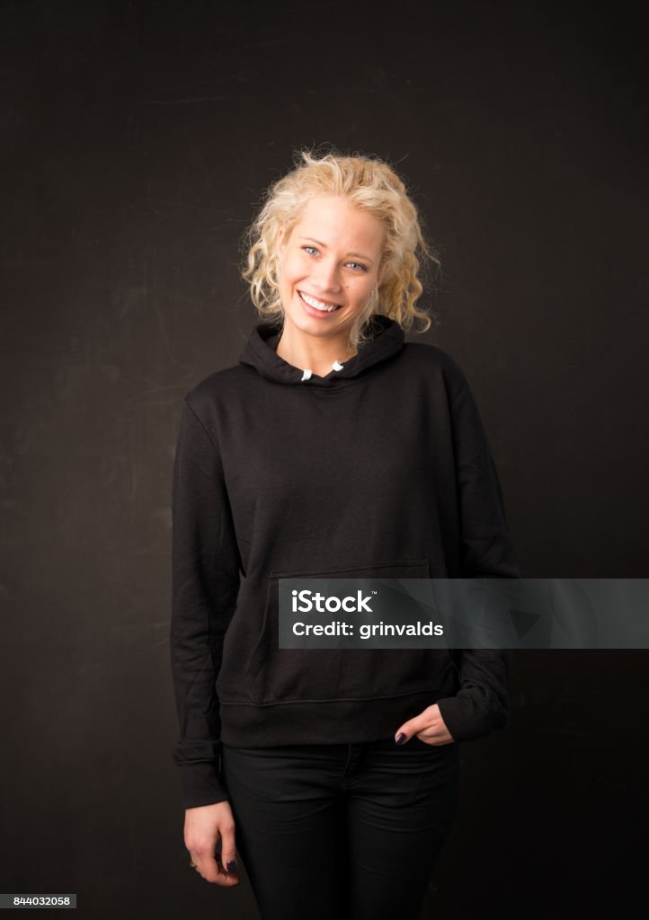 Woman wearing black sweater Women Stock Photo
