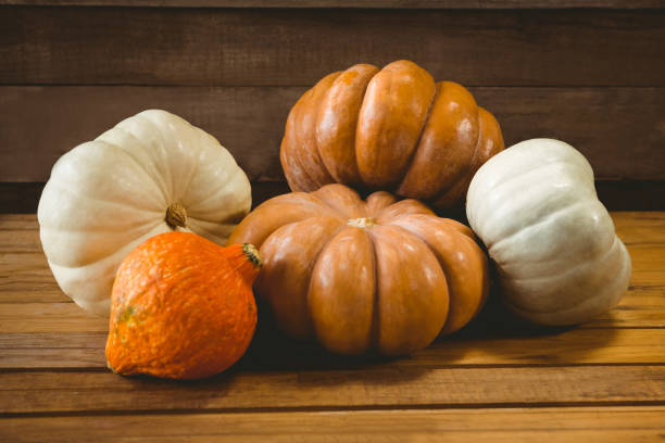 istock High angle view of colorful pumpkins on table 844038894