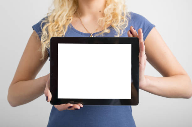 istock person holding blank screen tablet in hands 844040304