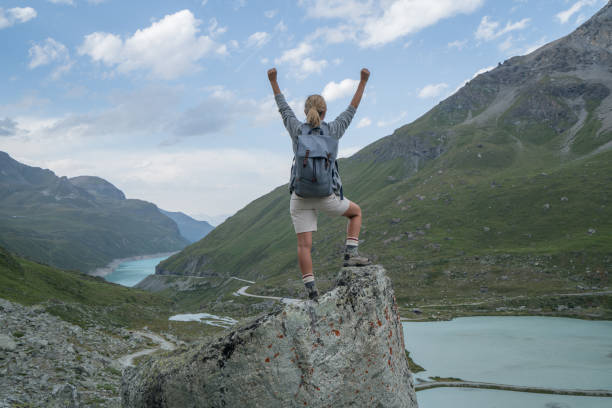 istock Hiker on top of rock arms outstretched 844045944