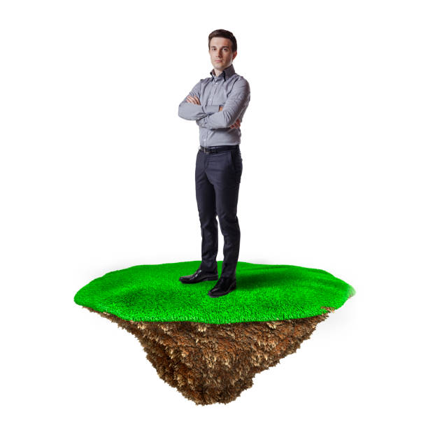 istock Business man on grass island, business concept 844046032