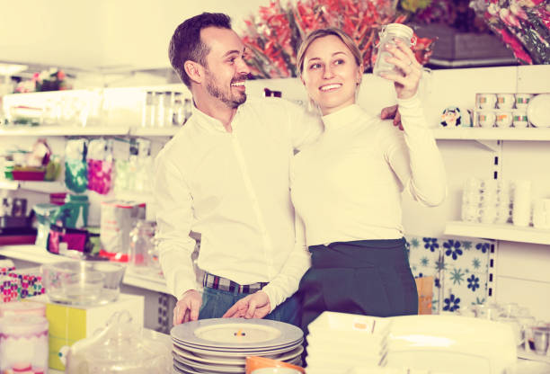 istock Couple selecting crockery in store 844046802
