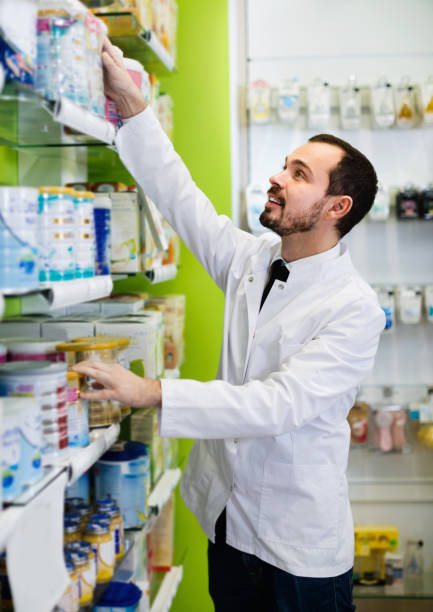 istock Male pharmacist looking for right medicine 844047096