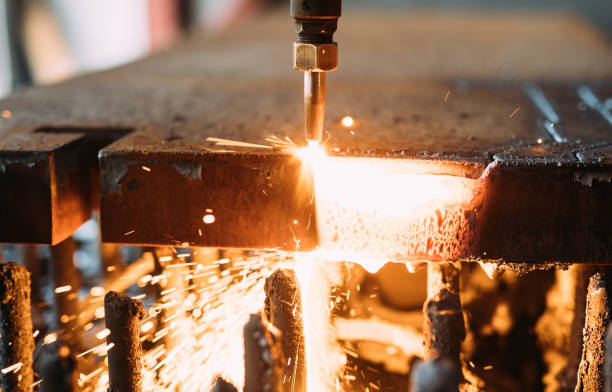 istock Oxygen torch cuts steel sheet. CNC gas cutting machine. Bright sparks 844047336