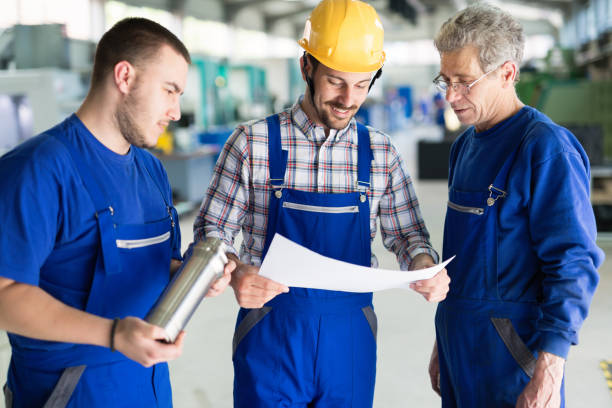 istock Portrait of an handsome engineer in a factory 844049444