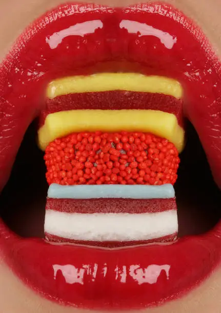 close up macro lips with sweets inside
