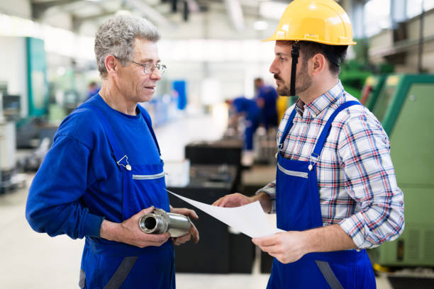 istock Team Of Engineers Having Discussion In Factory 844049464