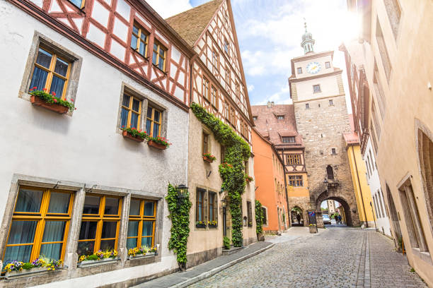 Medieval Roeder Gate in Rothenburg ob der Tauber Germany at sunset with warm lighting